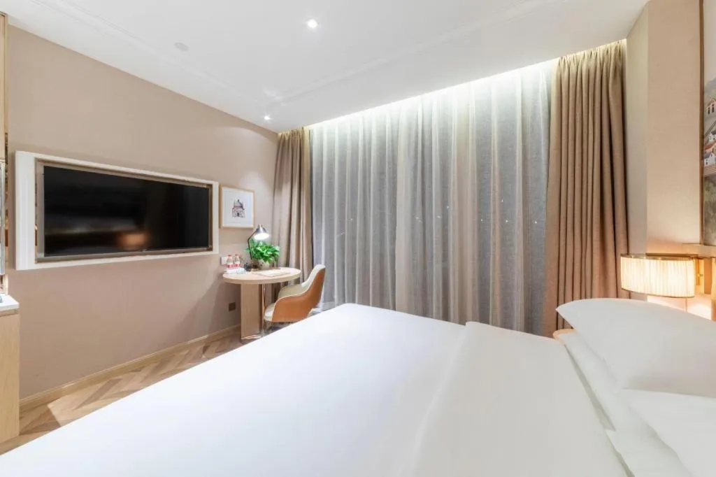 Bed in Vienna Hotel Chongqing West Station Square