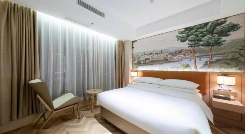 Bed in Vienna Hotel Chongqing West Station Square