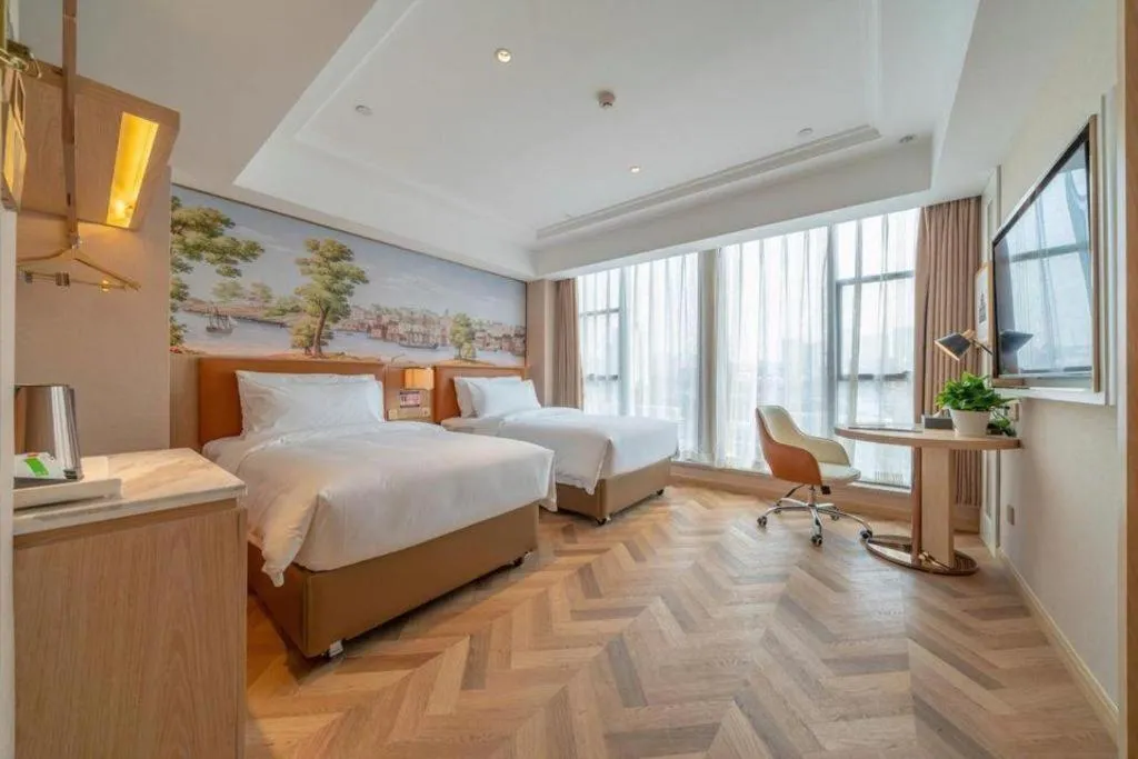 Bed in Vienna Hotel Chongqing West Station Square