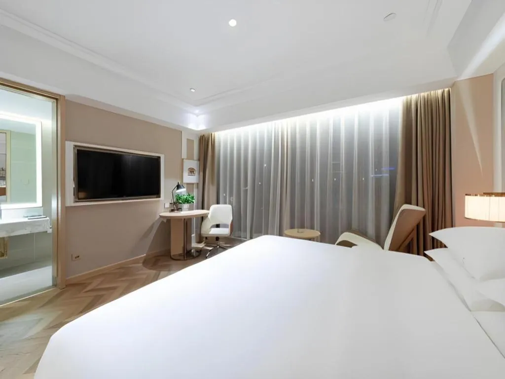 Bed in Vienna Hotel Chongqing West Station Square