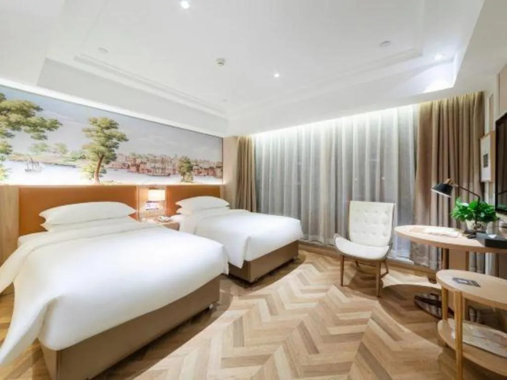 Bed in Vienna Hotel Chongqing West Station Square