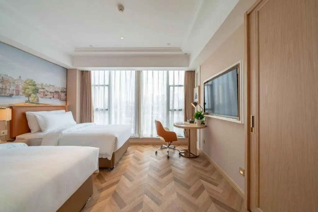 Bed in Vienna Hotel Chongqing West Station Square