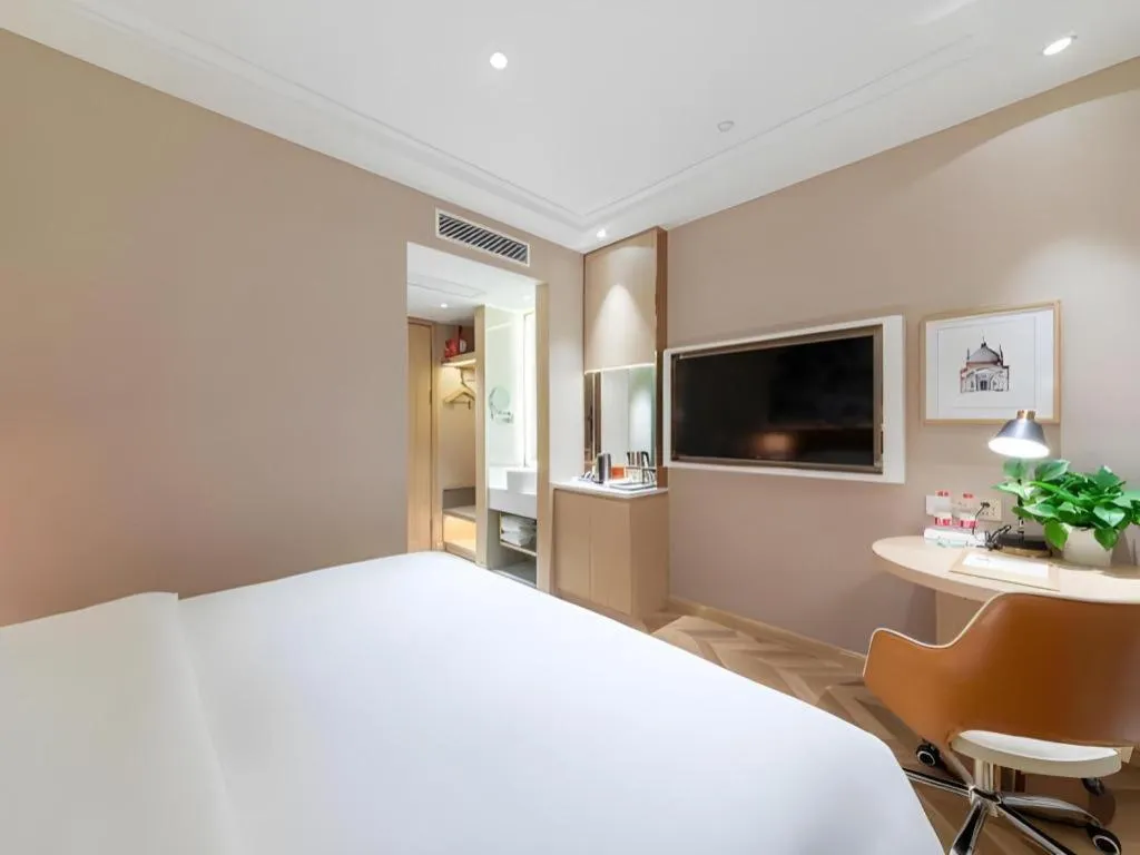 Bed in Vienna Hotel Chongqing West Station Square