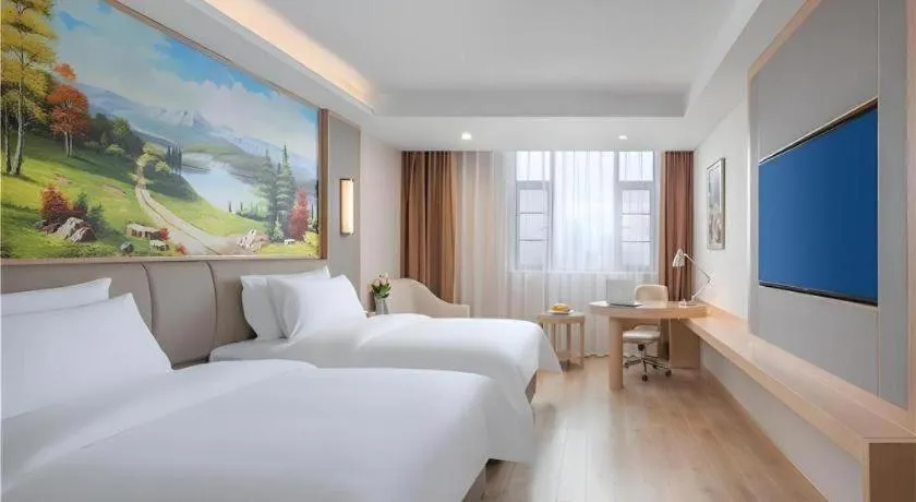 Bed in Vienna Hotel Yuxi Hongta Avenue High-Speed Railway Station