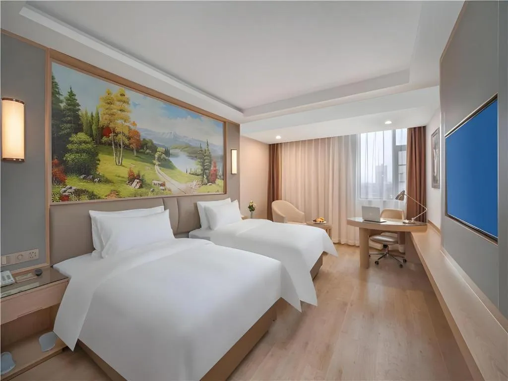 Bed in Vienna Hotel Yuxi Hongta Avenue High-Speed Railway Station