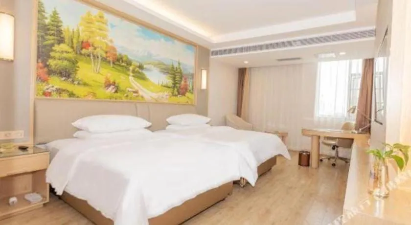 Bed in Vienna Hotel Yuxi Hongta Avenue High-Speed Railway Station