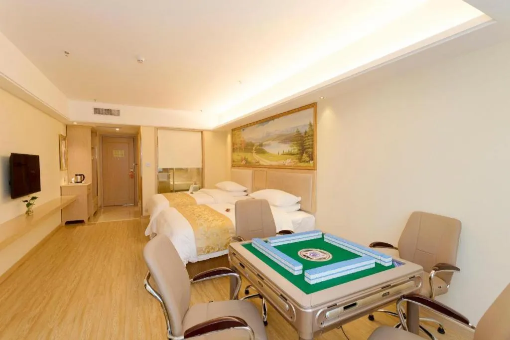 Bed in Vienna Hotel Chongqing Shizhu Stadium