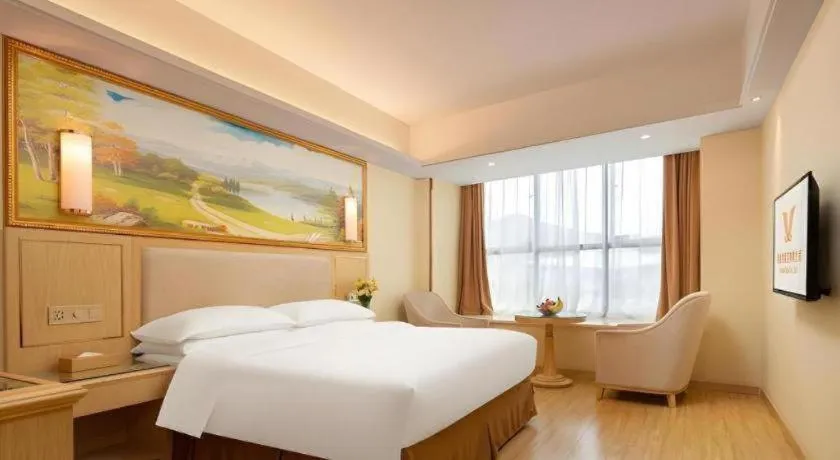 Bed in Vienna Hotel Chongqing Shizhu Stadium