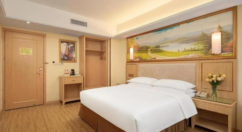 Bed in Vienna Hotel Chongqing Shizhu Stadium