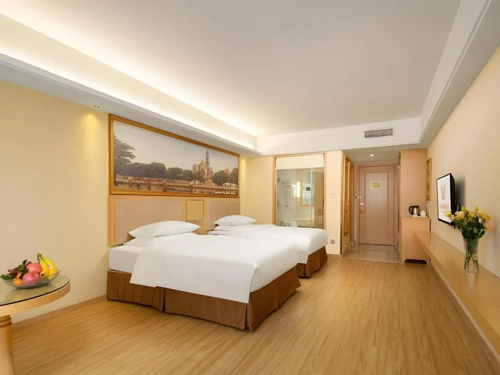 Bed in Vienna Hotel Chongqing Shizhu Stadium