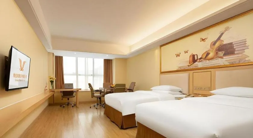 Bed in Vienna Hotel Chongqing Shizhu Stadium