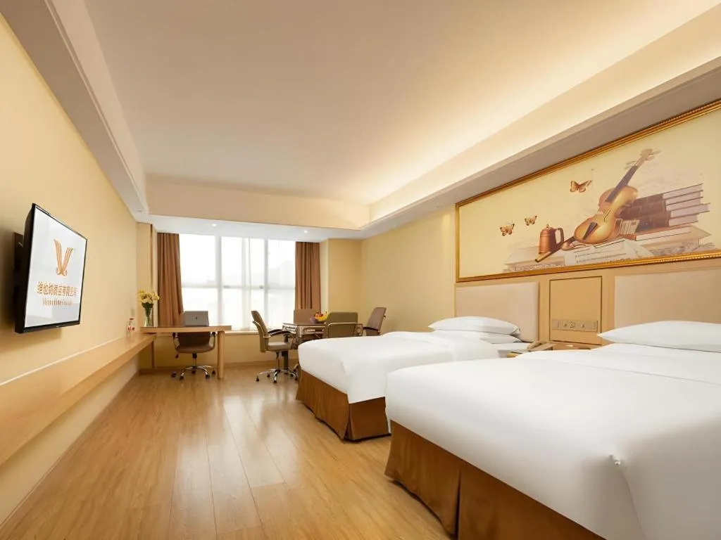 Bed in Vienna Hotel Chongqing Shizhu Stadium