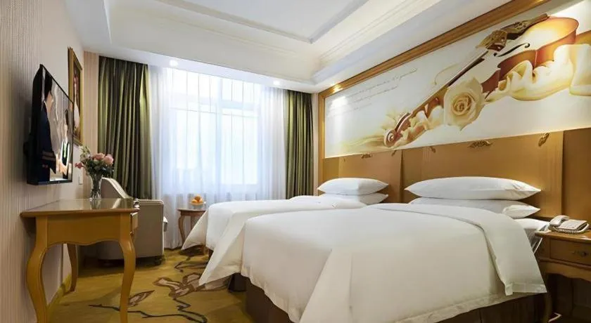 Bed in Vienna Hotel Guangdong Huidong Herung Pedestrian Street