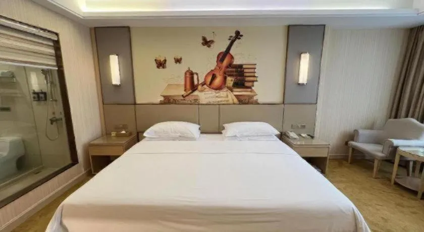 Bed in Vienna Hotel Guangdong Huidong Herung Pedestrian Street