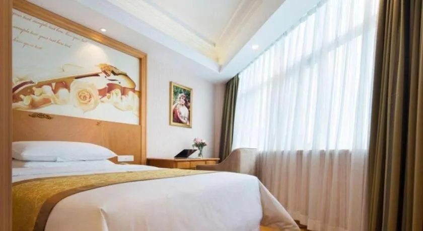 Bed in Vienna Hotel Guangdong Huidong Herung Pedestrian Street