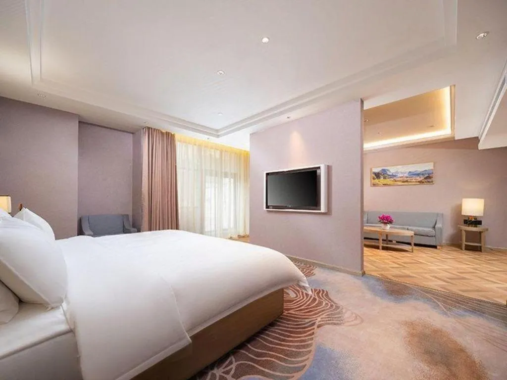 Bed in Vienna Hotel Lincang New Asia Pacific Times Square