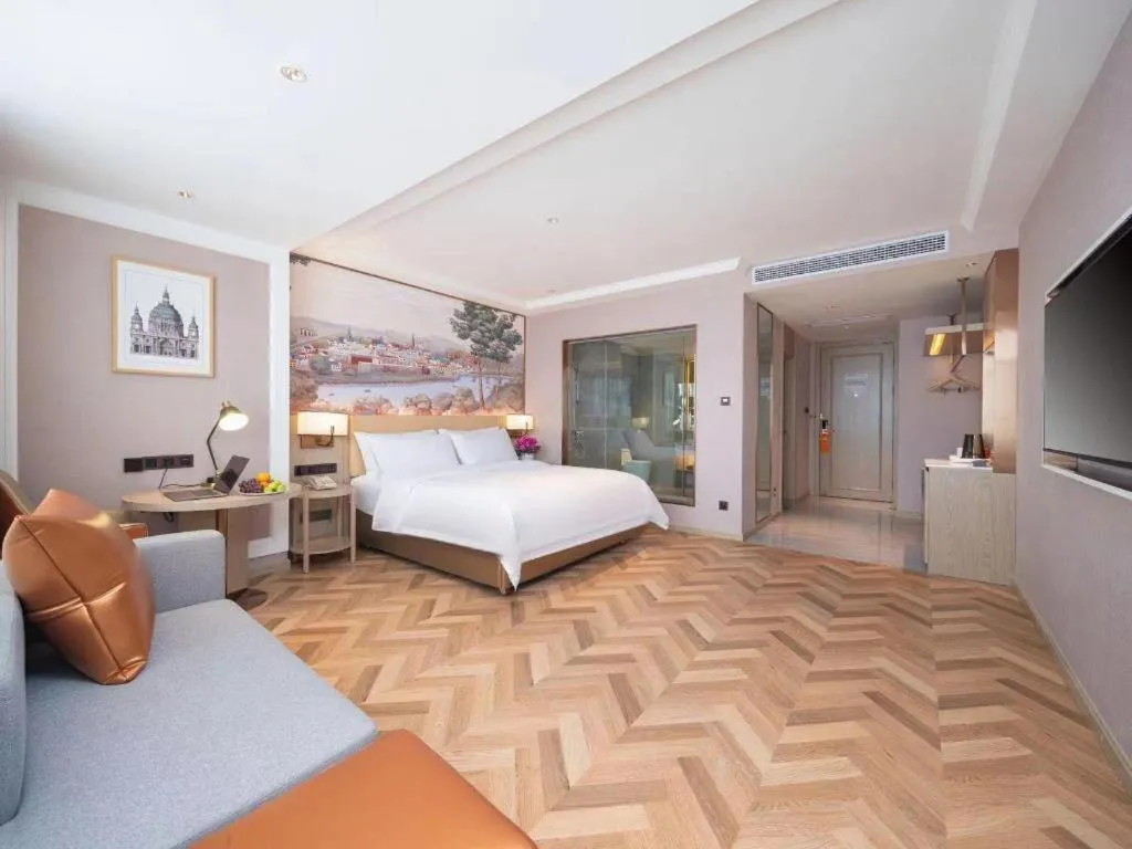 Bed in Vienna Hotel Lincang New Asia Pacific Times Square