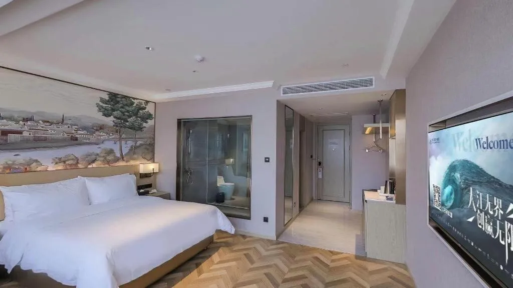 Bed in Vienna Hotel Lincang New Asia Pacific Times Square