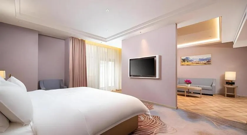 Bed in Vienna Hotel Lincang New Asia Pacific Times Square