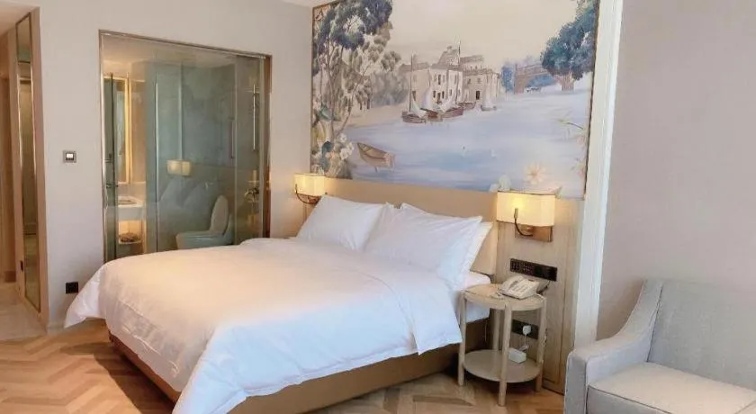 Bed in Vienna Hotel Lincang New Asia Pacific Times Square