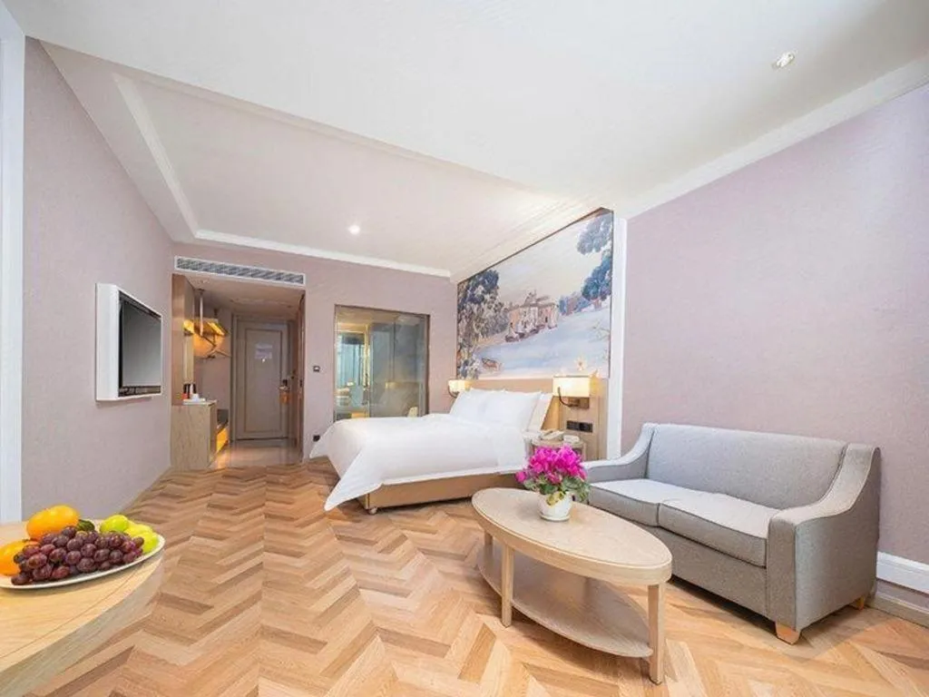 Bed in Vienna Hotel Lincang New Asia Pacific Times Square