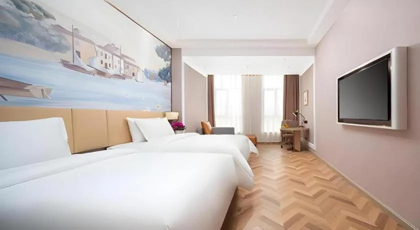 Bed in Vienna Hotel Lincang New Asia Pacific Times Square