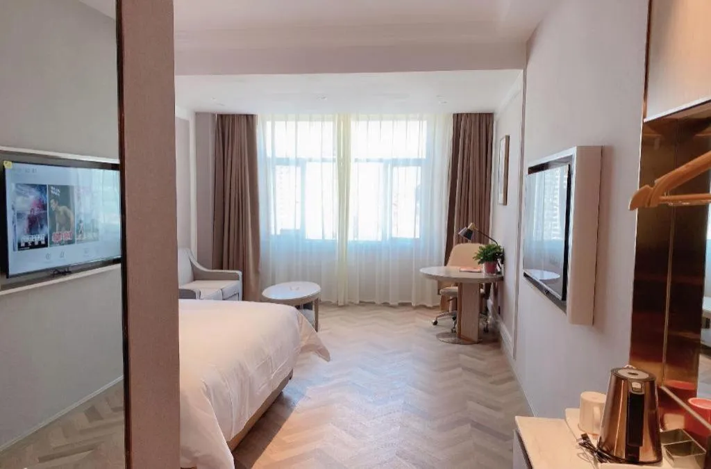 Bed in Vienna Hotel Lincang New Asia Pacific Times Square