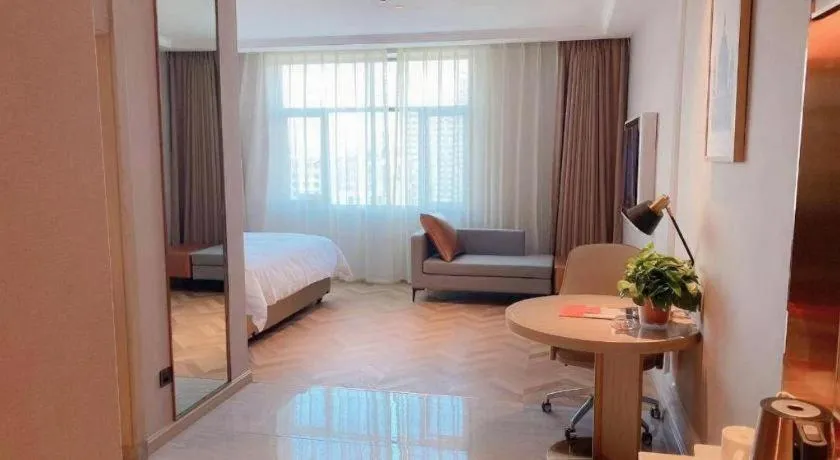 Bed in Vienna Hotel Lincang New Asia Pacific Times Square