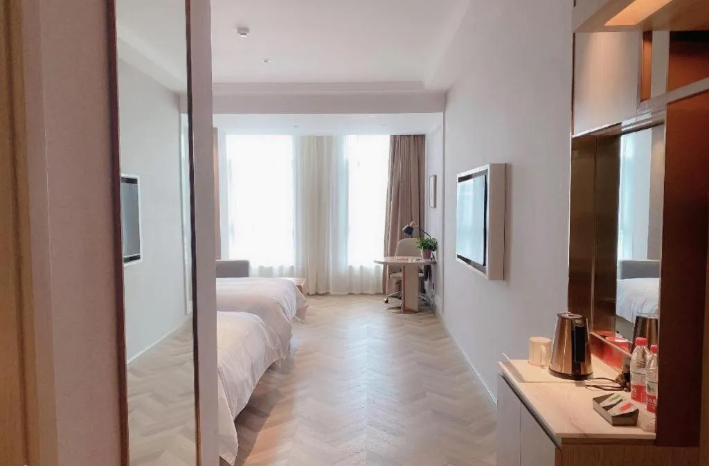 Bed in Vienna Hotel Lincang New Asia Pacific Times Square