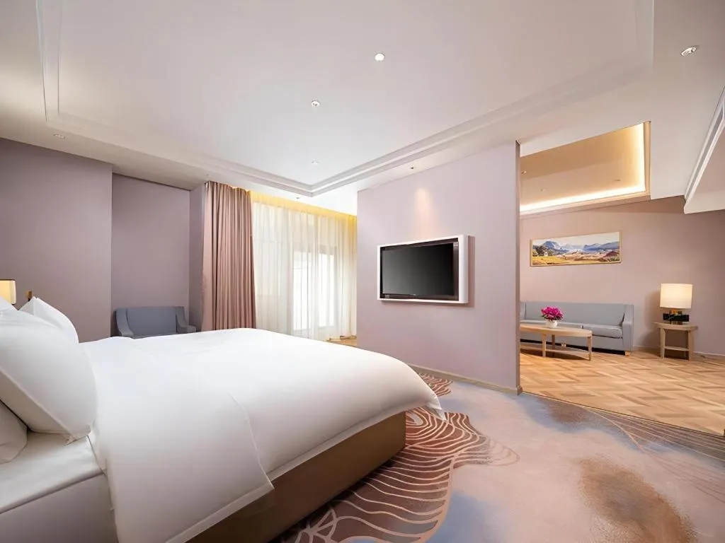 Bed in Vienna Hotel Lincang New Asia Pacific Times Square