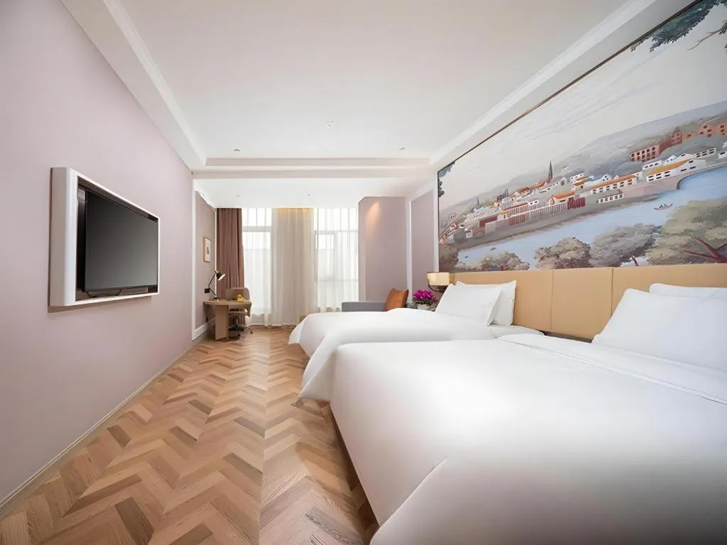 Bed in Vienna Hotel Lincang New Asia Pacific Times Square