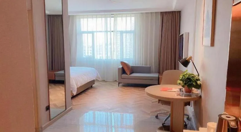 Bed in Vienna Hotel Lincang New Asia Pacific Times Square