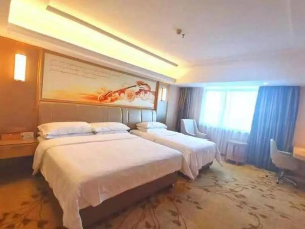 Bed in Vienna Hotel Guangxi Zhongshan Central Plaza West High-Speed Railway Station