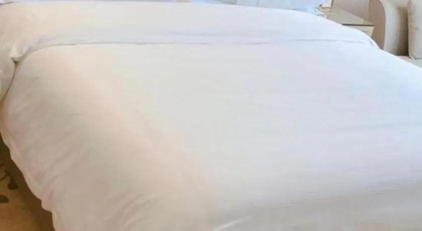 Bed in Vienna Hotel Guangxi Zhongshan Central Plaza West High-Speed Railway Station