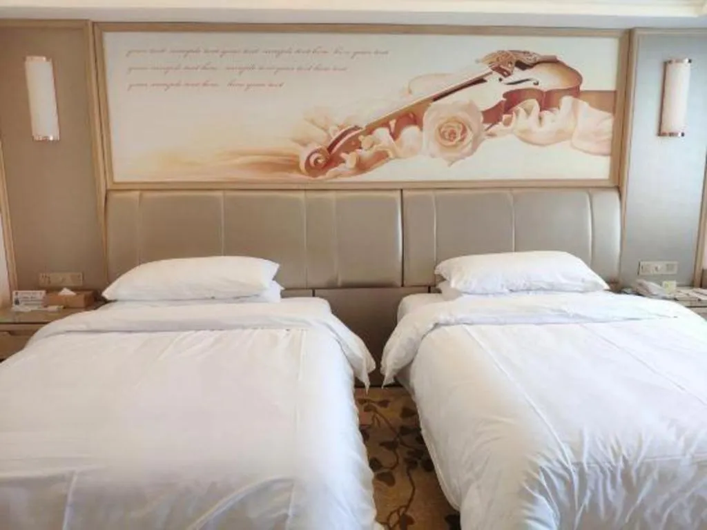 Bed in Vienna Hotel Guangxi Zhongshan Central Plaza West High-Speed Railway Station
