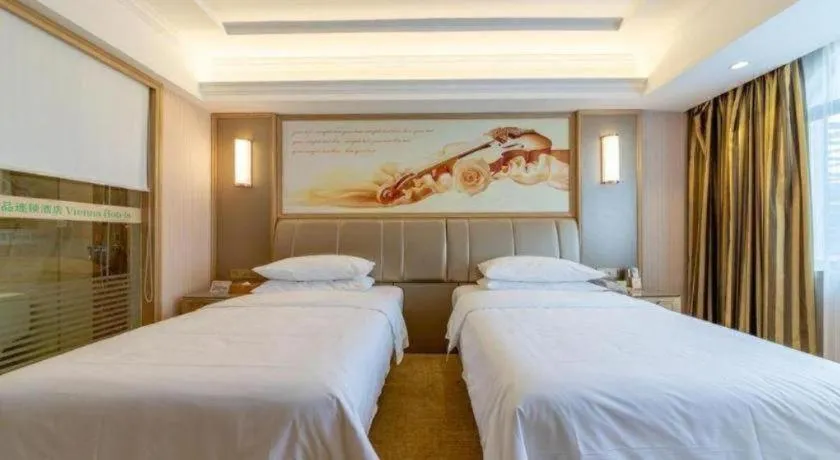 Bed in Vienna Hotel Guangxi Zhongshan Central Plaza West High-Speed Railway Station
