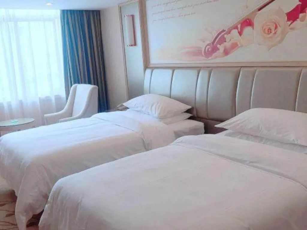 Bed in Vienna Hotel Guangxi Zhongshan Central Plaza West High-Speed Railway Station