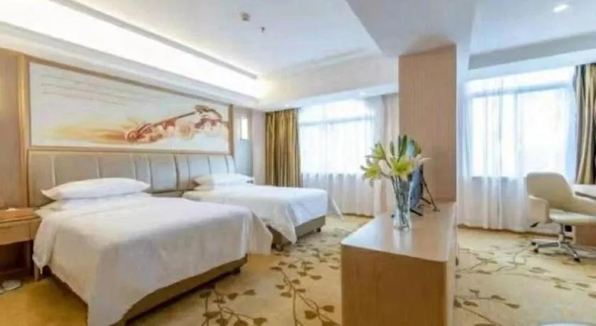 Bed in Vienna Hotel Guangxi Zhongshan Central Plaza West High-Speed Railway Station