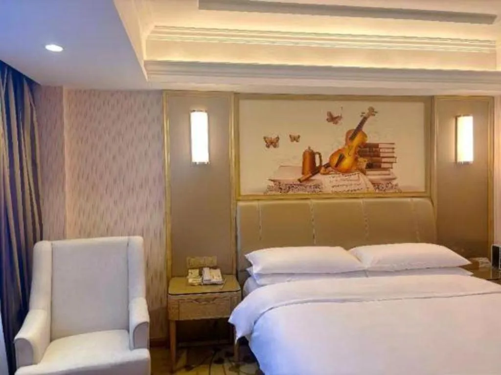 Bed in Vienna Hotel Guangxi Zhongshan Central Plaza West High-Speed Railway Station