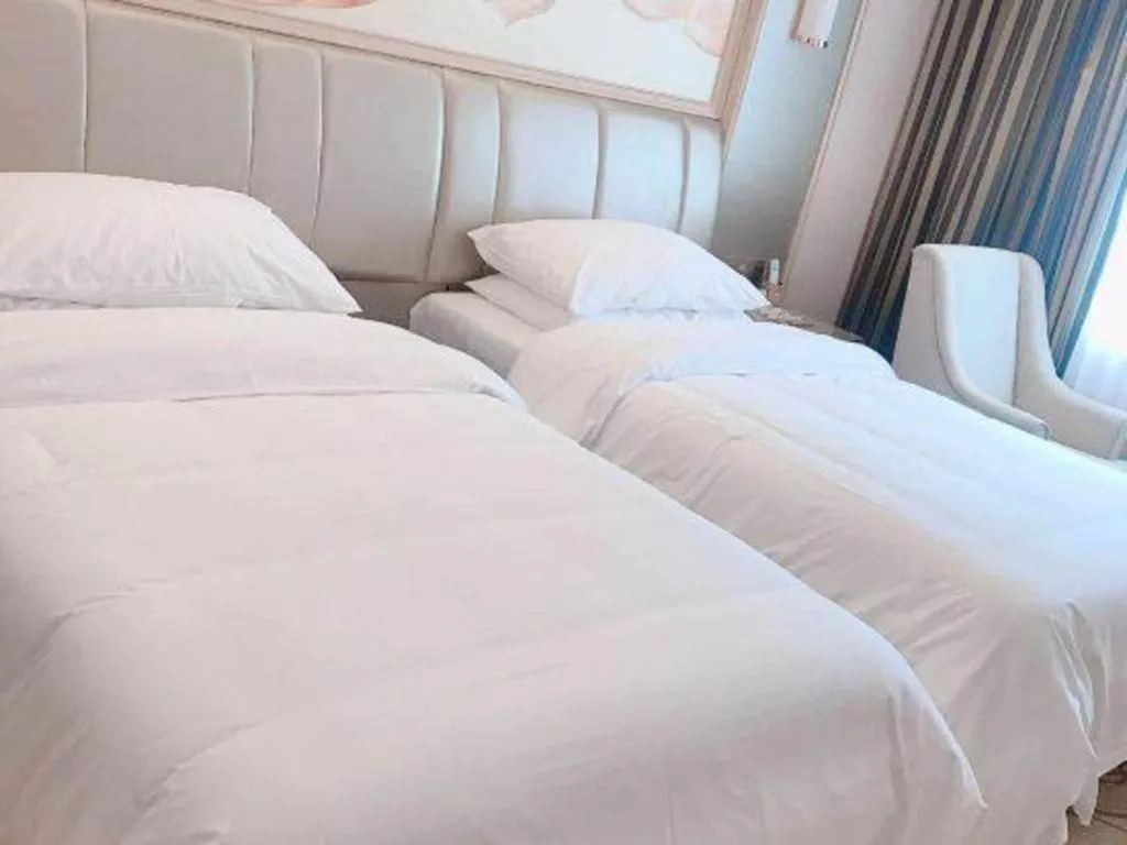 Bed in Vienna Hotel Guangxi Zhongshan Central Plaza West High-Speed Railway Station