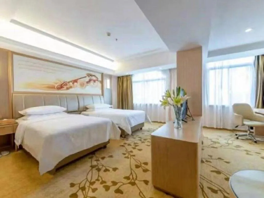 Bed in Vienna Hotel Guangxi Zhongshan Central Plaza West High-Speed Railway Station