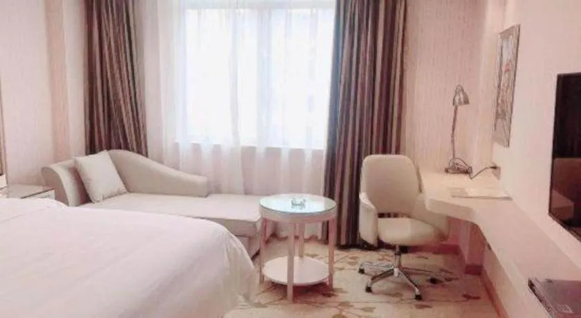 Bed in Vienna Hotel Guangxi Zhongshan Central Plaza West High-Speed Railway Station