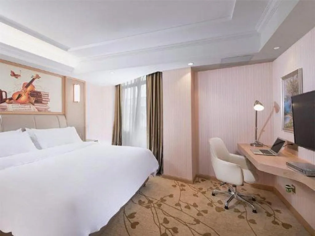 Bed in Vienna Hotel Guangxi Zhongshan Central Plaza West High-Speed Railway Station