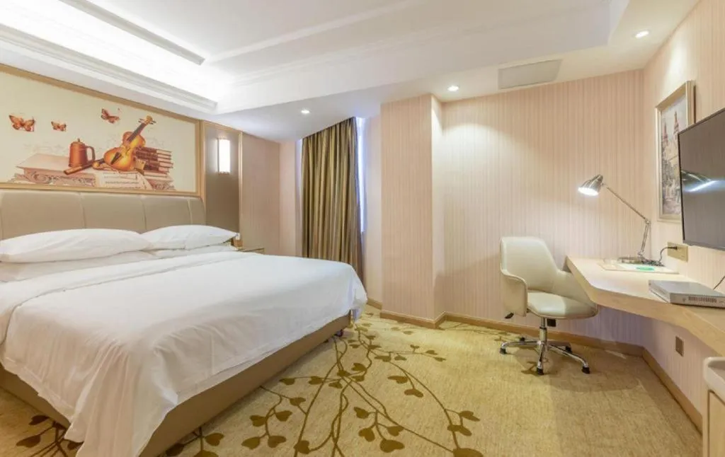 Bed in Vienna Hotel Guangxi Zhongshan Central Plaza West High-Speed Railway Station