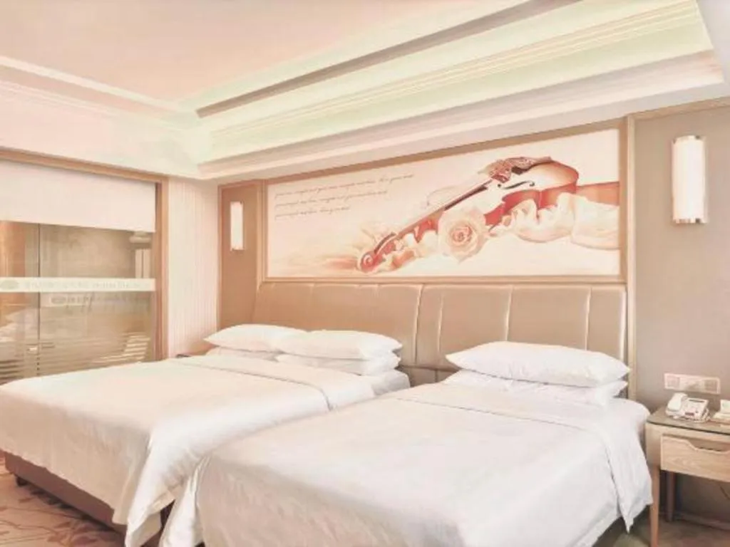 Bed in Vienna Hotel Guangxi Zhongshan Central Plaza West High-Speed Railway Station