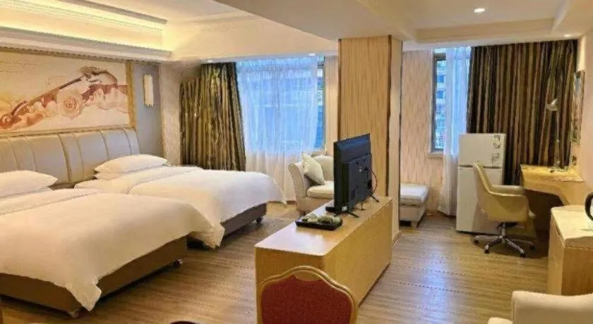 Bed in Vienna Hotel Guangxi Zhongshan Central Plaza West High-Speed Railway Station