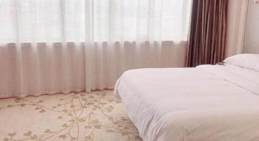 Bed in Vienna Hotel Guangxi Zhongshan Central Plaza West High-Speed Railway Station