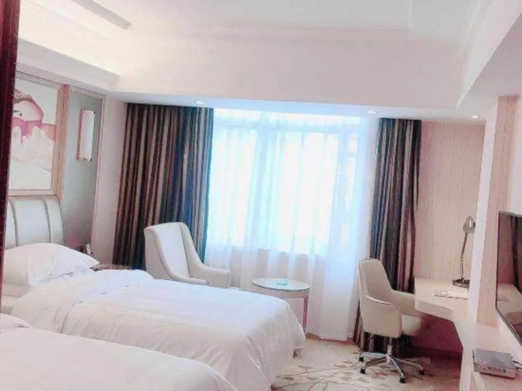 Bed in Vienna Hotel Guangxi Zhongshan Central Plaza West High-Speed Railway Station