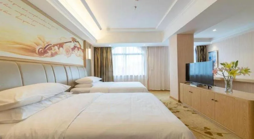 Bed in Vienna Hotel Guangxi Zhongshan Central Plaza West High-Speed Railway Station