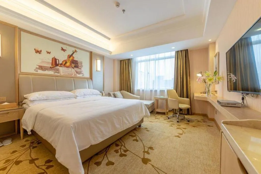 Bed in Vienna Hotel Guangxi Zhongshan Central Plaza West High-Speed Railway Station